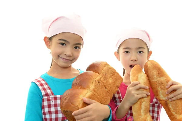 Girls holding bread — Stock Photo, Image