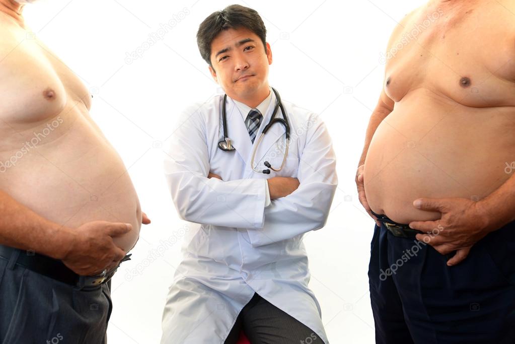 Serious doctor examining patients obesity