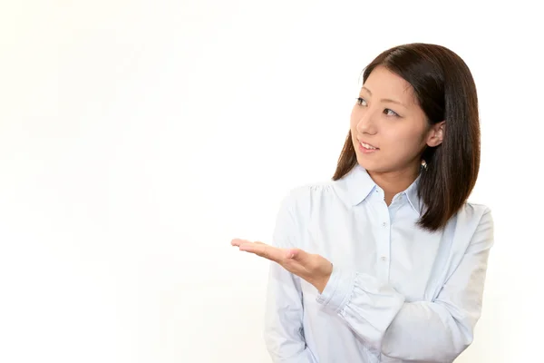 Woman showing something on the palm of her hand — Stock Photo, Image