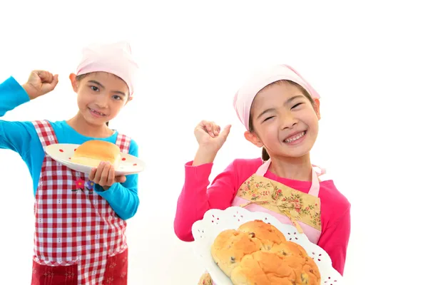 Smiling girls with bread — Stock Photo, Image