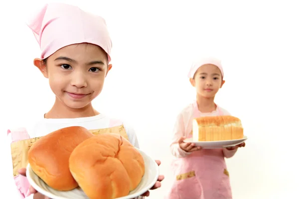 Girls holding bread — Stock Photo, Image