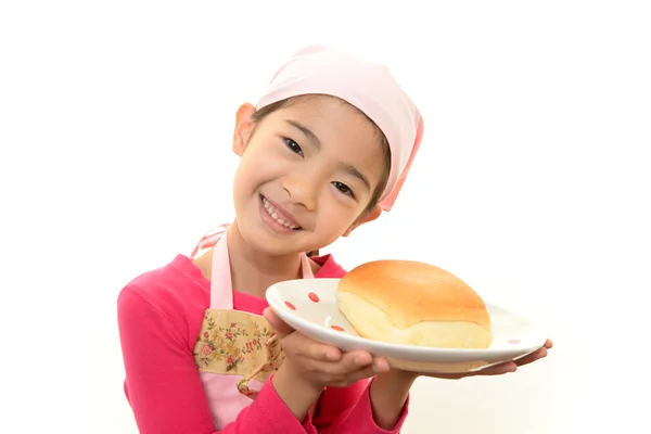 Girl holding a bread — Stock Photo, Image