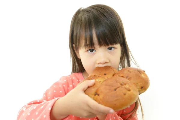 Little girl eating bread — Stock Photo, Image