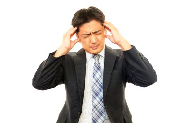 baş ağrısı olan işadamı