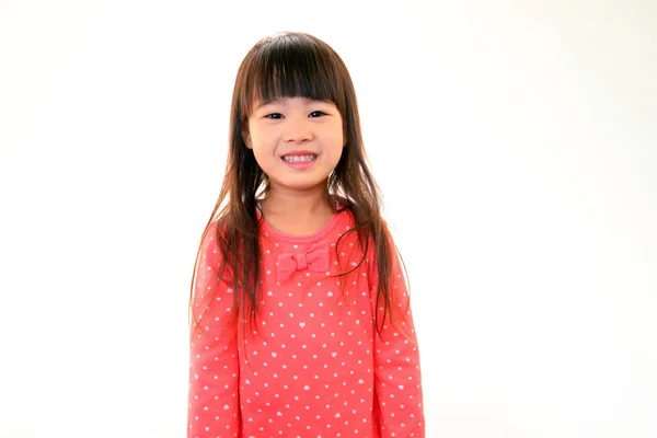 Feliz chica asiática sonrisa en su cara — Foto de Stock