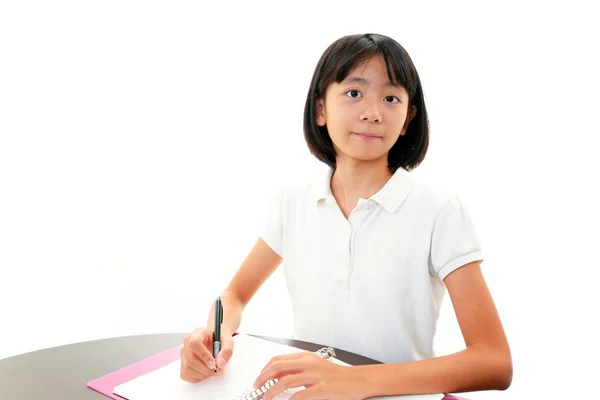 Ragazza che studia alla scrivania — Foto Stock