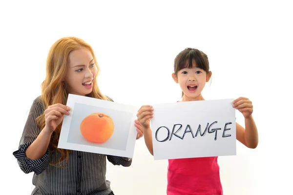 Girl studying in English with teacher — Stock Photo, Image