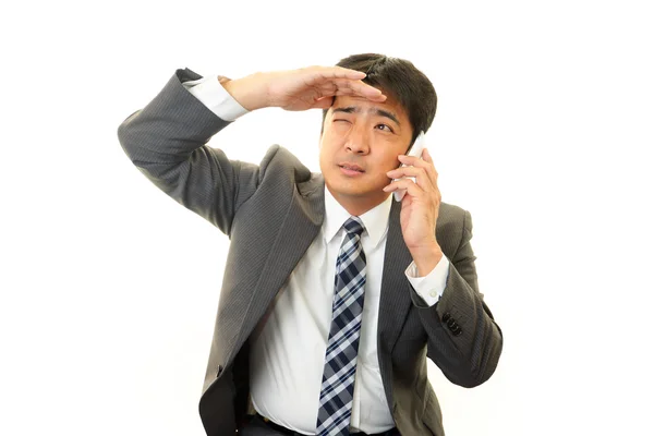 Tired and stressed Asian businessman — Stock Photo, Image