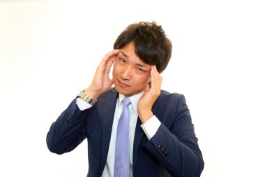 baş ağrısı olan işadamı