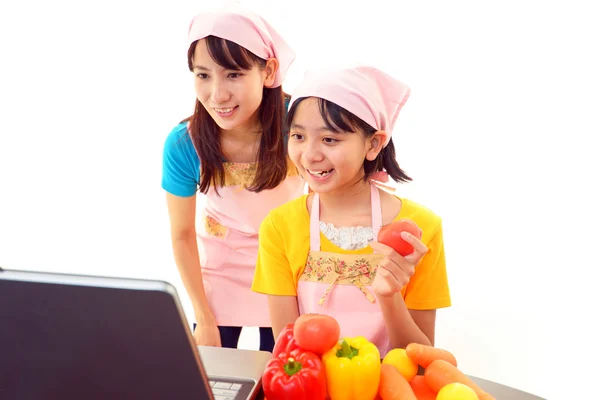 Child with mother cook — Stock Photo, Image