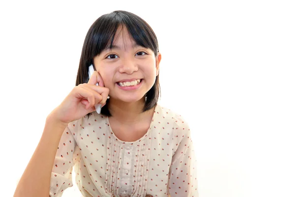 Happy young girl holding mobile phone — Stock Photo, Image