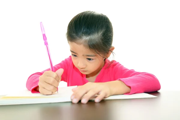 Ragazza che studia alla scrivania — Foto Stock