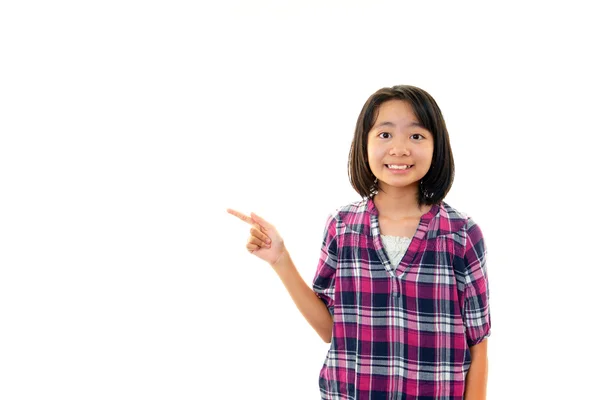 Sorrindo menina apontando . — Fotografia de Stock