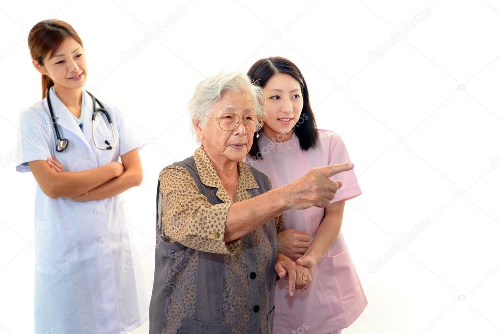 Medical staff with senior woman
