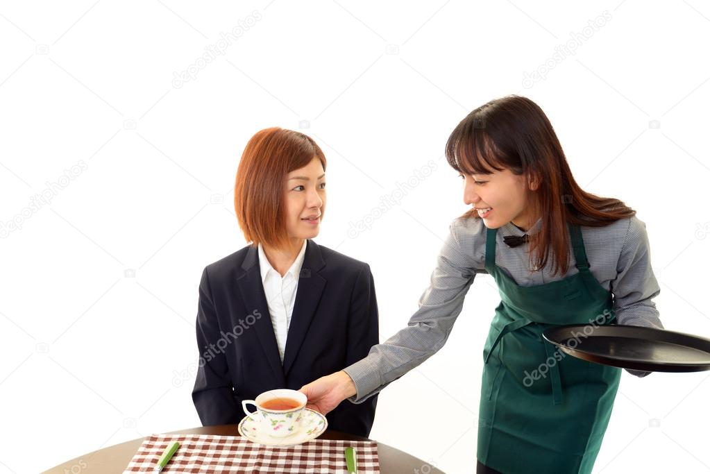 Waitress serving customer