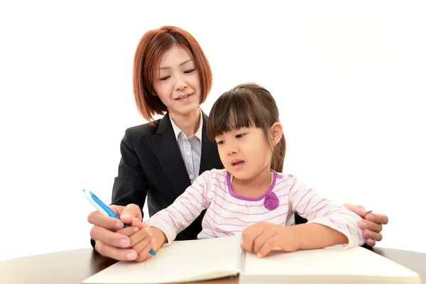 Teacher with little girl studying. — Stock Photo, Image