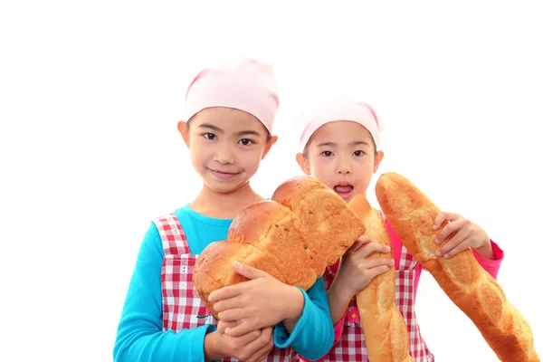 Girls holding bread — Stock Photo, Image