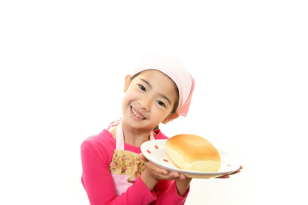 Girl holding a bread — Stock Photo, Image