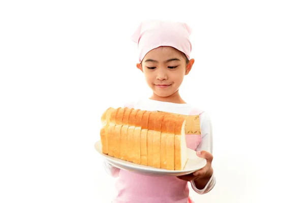 Girl holding bread — Stock Photo, Image