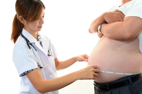 Serious doctor examining a patient obesity — Stock Photo, Image