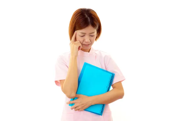 Nurse having a headache — Stock Photo, Image