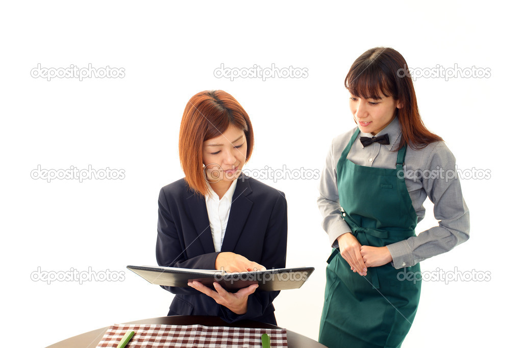 Waitress shows the menu to customer