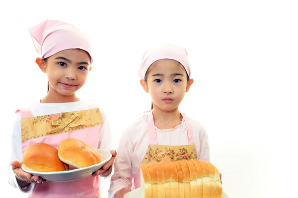 Girls holding bread — Stock Photo, Image