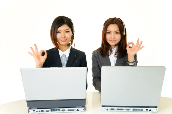 Smiling call center operators — Stock Photo, Image