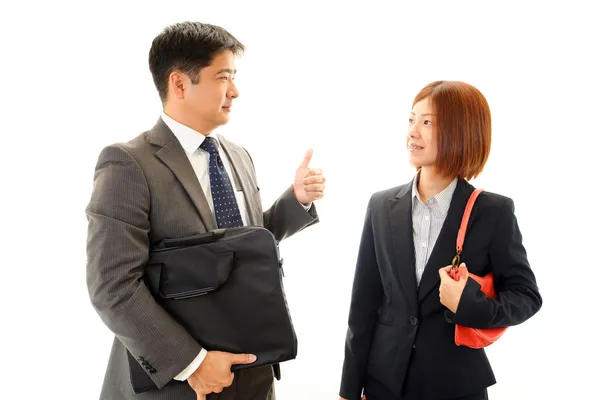 Smiling businessman and businesswoman — Stock Photo, Image