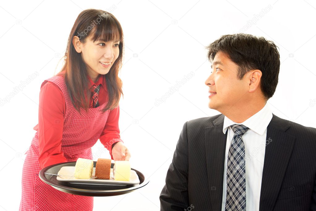 Waitress delivering sweets to table