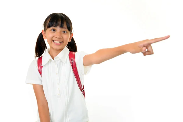 Chica sonriente señalando —  Fotos de Stock