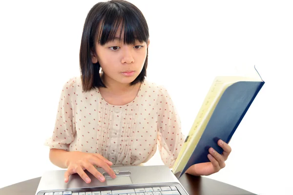 Girl using a laptop — Stock Photo, Image