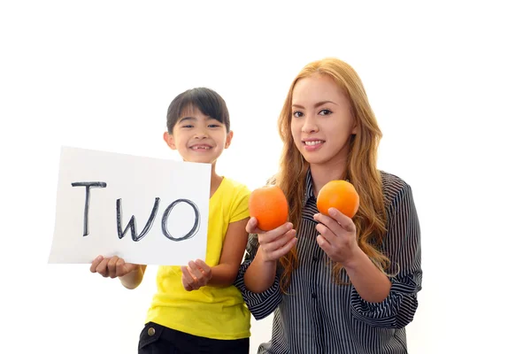 English teacher with girl studying. — Stock Photo, Image