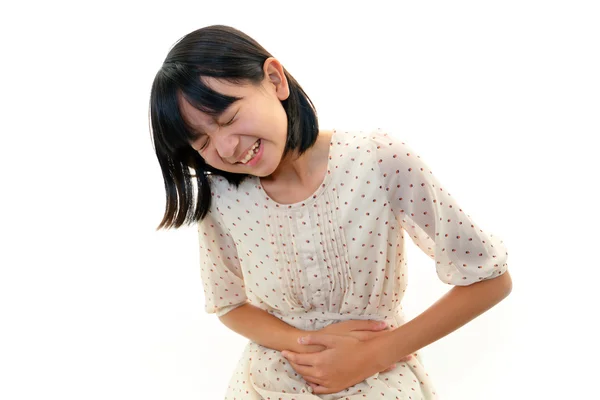 Ein Mädchen mit Bauchschmerzen lizenzfreie Stockfotos