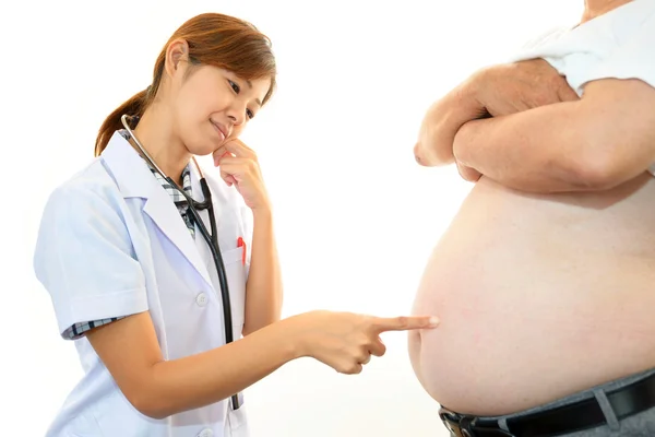 Serious doctor examining a patient obesity — Stock Photo, Image