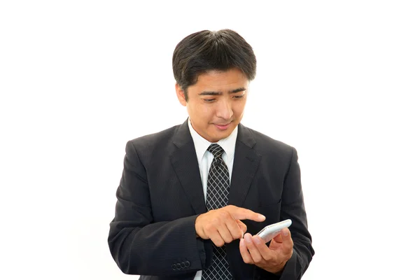 Mobile phone and business man — Stock Photo, Image