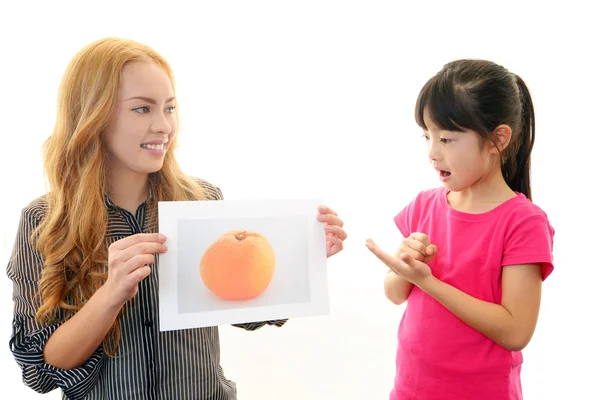 English teacher with girl studying. — Stock Photo, Image