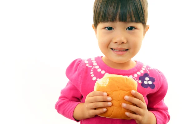 Little girl eating bread — Stock Photo, Image