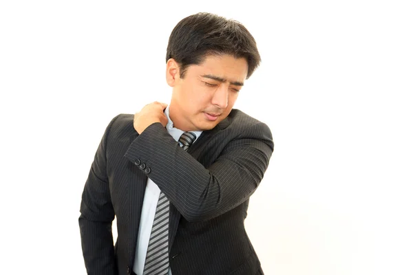 Empresário com dor no ombro . — Fotografia de Stock