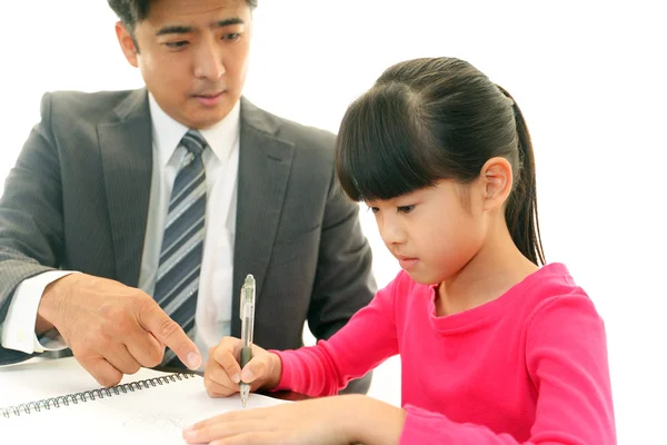 Leraar met meisje studeren. — Stockfoto