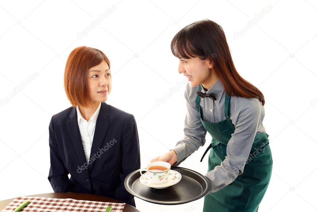 Waitress serving customer
