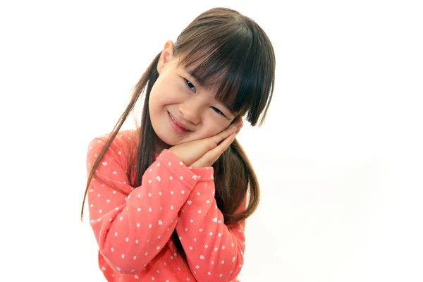 Menina asiática feliz sorriso em seu rosto — Fotografia de Stock