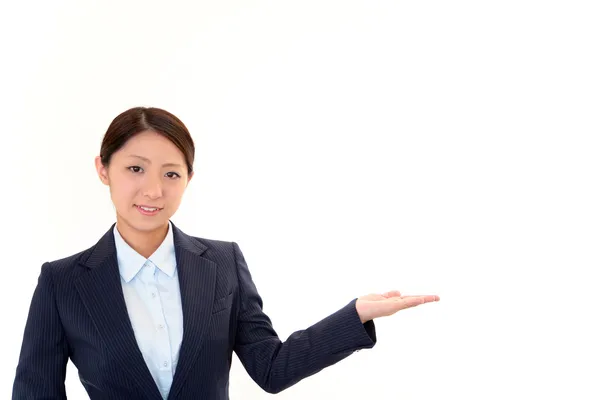 Beautiful business woman showing something with her hand — Stock Photo, Image