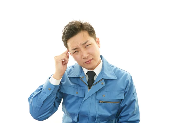 Tired and stressed Asian worker — Stock Photo, Image