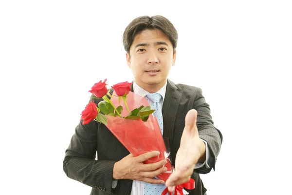 Man holding flower bouquet — Stock Photo, Image