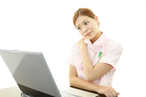 Tired female nurse — Stock Photo, Image