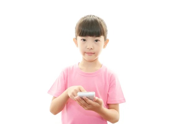 Happy girl holding mobile phone — Stock Photo, Image