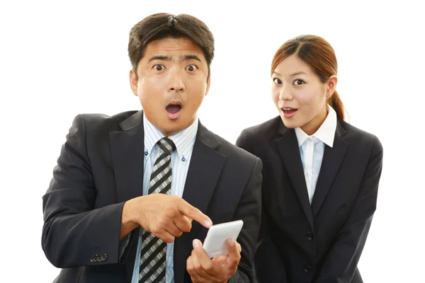 Surprised businessman and businesswoman — Stock Photo, Image