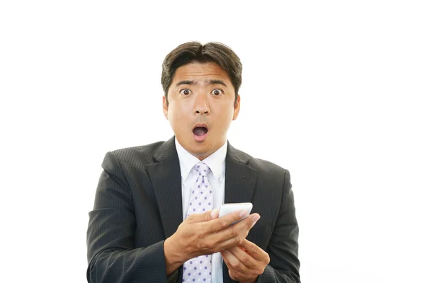 Surprised Asian businessman — Stock Photo, Image