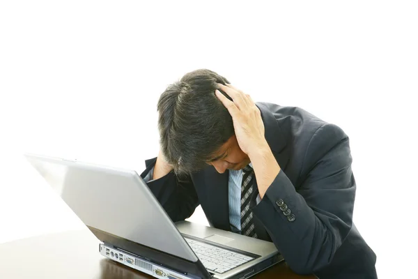 Stressed Asian businessman — Stock Photo, Image